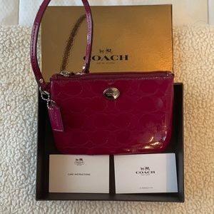 Never used Coach Cranberry wristlet